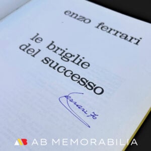 Close-up of Enzo Ferrari autograph inside Le Briglie del Successo, a rare signed Ferrari book and historic Formula 1 memorabilia piece.