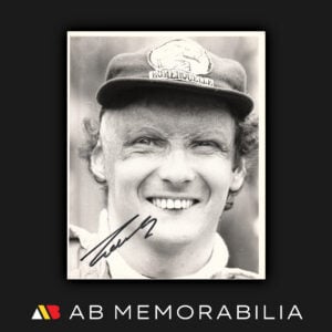 Niki Lauda autograph signed original hand printed photograph wearing his Römerquelle signature cap during the 1977 Monaco Grand Prix. Ferrari memorabilia